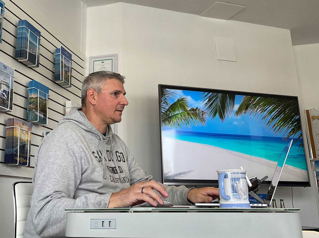 profile picture sitting at an office desk